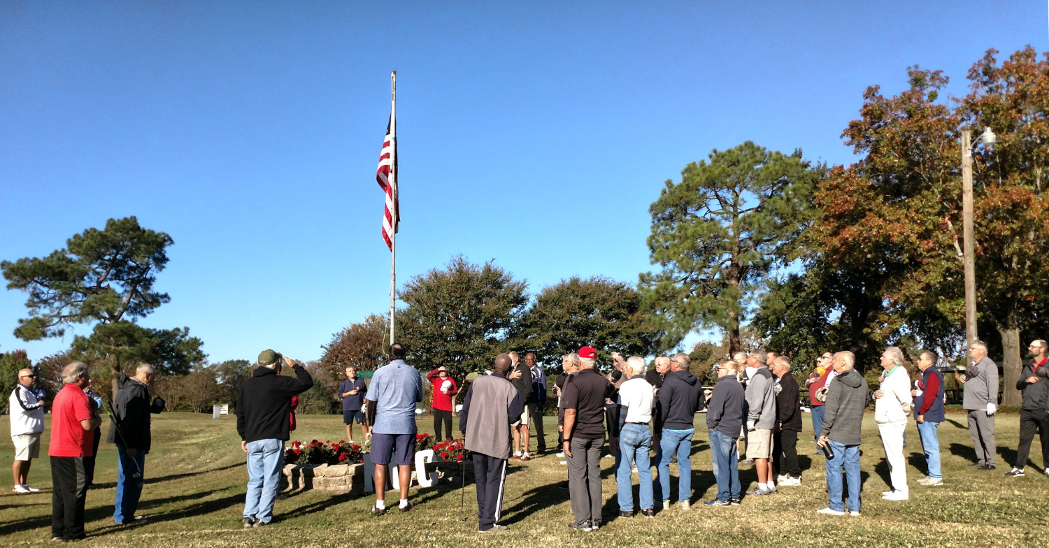 At the Mineola Country Club annual Veterans Golf Tournament last Wednesday, veterans stand for the National Anthem beautifully sung by Michelle Simmons prior to the start of play.